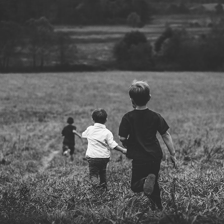 Three Kids Running in Field - BlindNewWorld