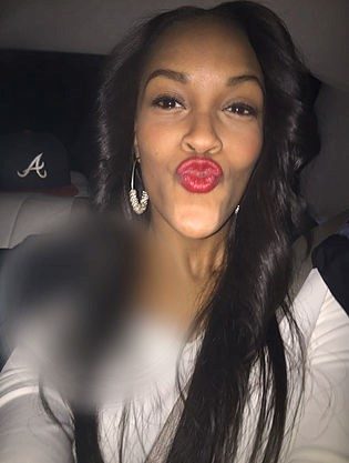 Nysha Charlene headshot with blurry spot below her face