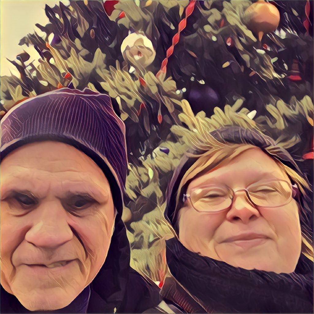 Jerry and Amy Young in front of their Christmas tree