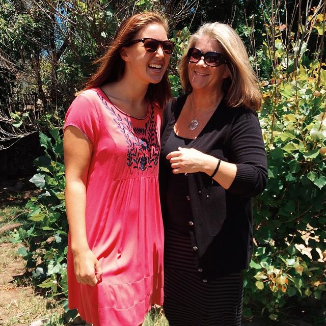 Molly and her mother Maria Johnson in front of a bush
