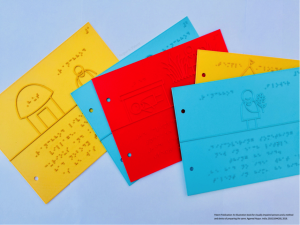 Five colorful sheets that have been 3D printed with braille as well as illustrations. 