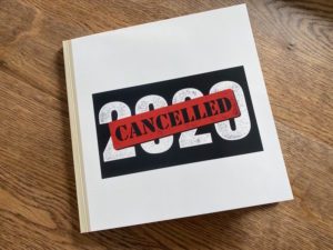A white book. On the cover, the number 2020 is in black and white with the word "cancelled" in all caps stamped across in bold red.