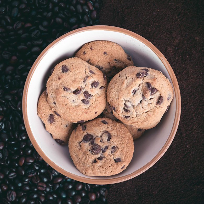 A Plate of Chocolate Chip Cookies over Coffee Beans