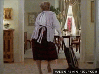 GIF of Mrs. Doubtfire vacuuming the floor and dancing.