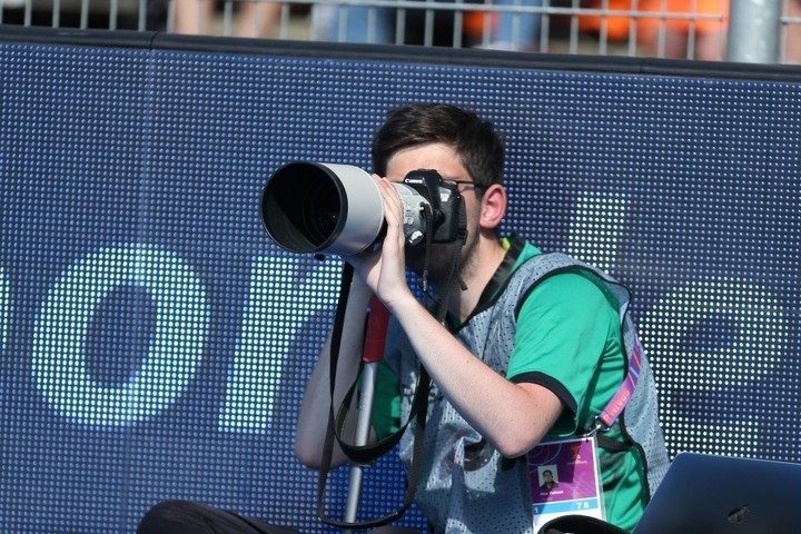 Blind photographer Max Fulham, behind the lens, captures the action during the World Cup in Amstelveen, Netherlands | Photo credit: Alwyn Robinson